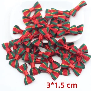 Detail of 3x1.5 cm red and green striped Christmas bows with gold metallic thread