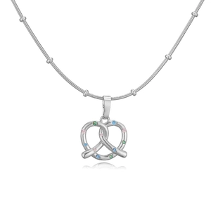 Macro shot of silver snake chain necklace with pretzel heart pendant and colorful crystals