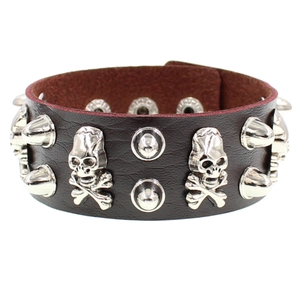 Dark brown leather punk bracelet with silver skull charms and metallic spike studs