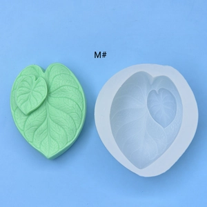 Macro view of monstera leaf silicone mold with detailed vein textures for baking DIY