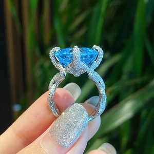 Luxury Asscher cut blue topaz ring with pavé micro-set diamonds in sterling silver