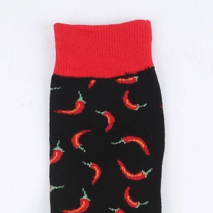 Detail view of cotton blend crew socks featuring red chili pattern and ribbed cuffs