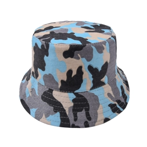 Detail of outdoor bucket hat featuring blue and grey camouflage pattern and durable canvas