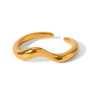 Close-up of a minimalist golden wave ring showing high-polished stainless steel texture