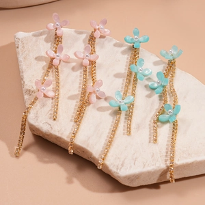 Floral tassel drop earrings with resin petals and shimmering zircon gold chains
