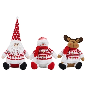 Three plush Christmas dolls featuring Santa, a snowman, and a reindeer in red knit outfits