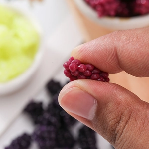 Macro close-up of a realistic red simulation raspberry squishy toy with detailed texture