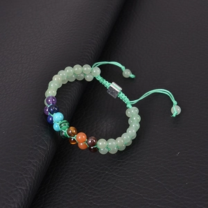 Detailed close-up of double-layer green malachite bead bracelet with tree of life buckle