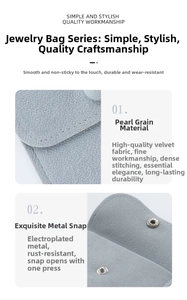 Close-up of light blue velvet jewelry pouch with metal snap button and fine stitching