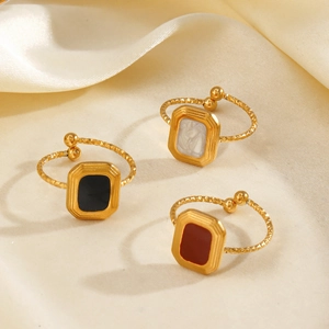 Minimalist square geometric gold rings with black white and red enamel inlays