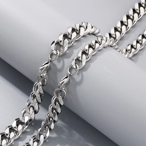 Detail view of a silver stainless steel Cuban link chain necklace with a lobster clasp