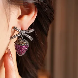 Vintage bow strawberry drop earrings with pink zircon stones and gunmetal finish
