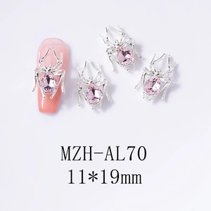 Close-up of 11x19mm silver spider nail charm with a pear-shaped pink crystal inlay