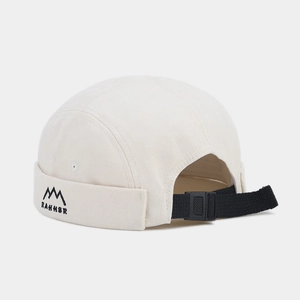 Detail of off-white brimless cap with RAHHER embroidery and adjustable strap buckle
