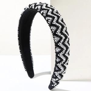 Detail showing the geometric wave pattern and hand-woven beads on wide headband
