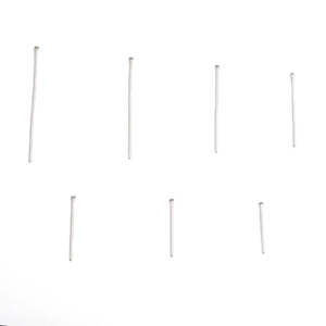 Detail view of various lengths of silver stainless steel T-pins for DIY jewelry making