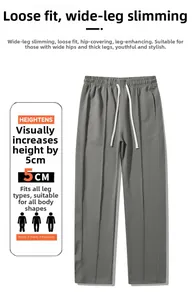 Detail of light grey straight-leg joggers showing soft fabric and 5cm heightening effect