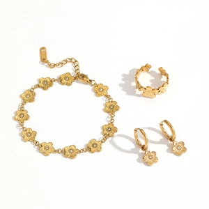 Parure de bijoux fleur dorée avec cristaux comprenant bracelet bague et boucles