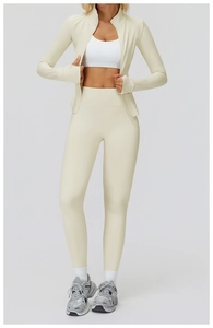 Detailed full-body view of a cream fitness jacket and matching high-waist yoga leggings