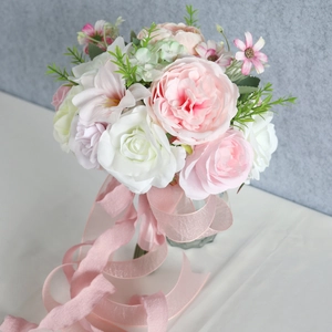 Artificial bridal bouquet with pink roses and peonies featuring long silk ribbons