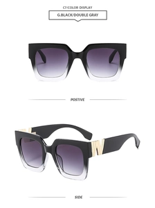 Detail view of square black sunglasses with gradient purple lenses and gold W metal hinges