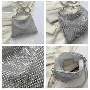 Close-up of silver rhinestone crossbody bag with sparkling mesh texture and interior lining