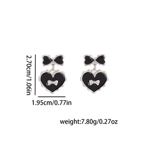 Guide des tailles des boucles d'oreilles nœud noir avec hauteur 2,70cm et largeur 1,95cm
