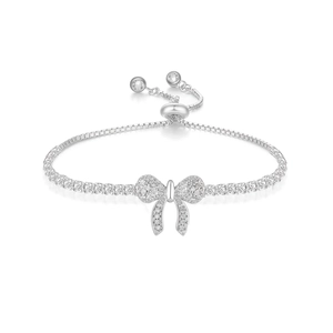Detailed close-up of a silver bow tennis bracelet with sparkling cubic zirconia stones