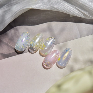 Detailed view of 5-piece relief nail art stickers with colorful stars and glitter effects