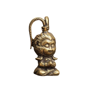 Miniature bronze Wukong monkey king metal statue in a praying meditative pose