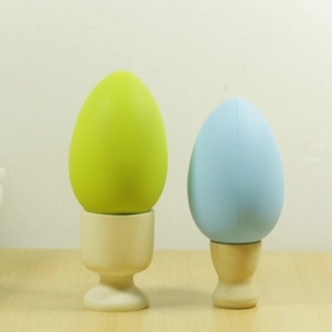 Minimalist wooden egg holder set with colorful decorative eggs for Easter decor