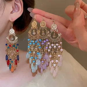 Bohemian seed bead tassel earrings with teardrop pendants and vintage ethnic gold hooks
