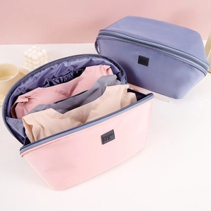 Detail view of pink and purple stone texture makeup bags with internal storage compartments
