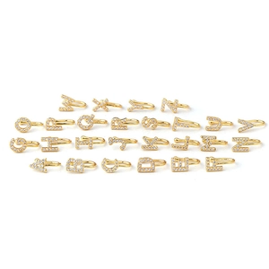 Golden 26 English letters nose cuff set with micro-paved zircon on white background