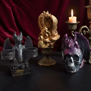 Gothic dragon and skull candle holder set with detailed resin scales in mystical setting