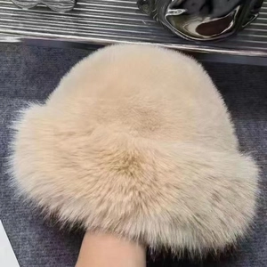 Close-up of beige plush faux fur winter hat showing fluffy texture and soft material