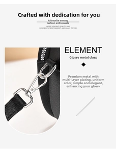 Detail of silver-tone metal clasp and litchi texture on black leather crossbody bag