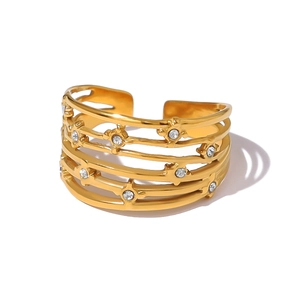 French style gold multi-layer open ring with sparkling crystals on white background