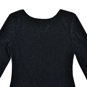 Detail of backless black jumpsuit with shimmering fabric and vertical seam line