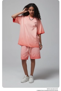 Detail of pink-orange gradient casual set with drawstring shorts and drop shoulder tee