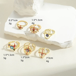 Golden Evil Eye and Hamsa Hand ring set with colorful enamel and diamond accents