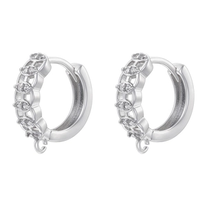 Detail of silver hoop earrings with white zircon inlay and functional hanging loops