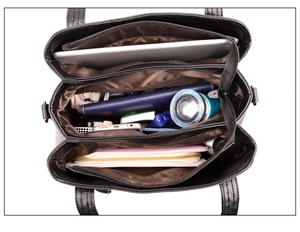 Top view of large black leather handbag showing three compartments and spacious interior