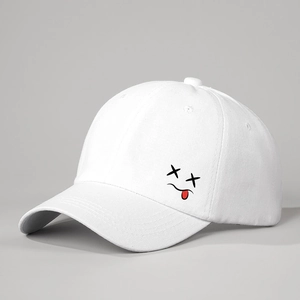 White cotton baseball cap with funny tongue out emoji print and adjustable strap