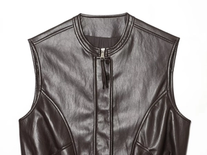 Detail of dark brown leather vest featuring a small stand collar and zipper texture