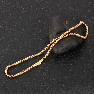 Macro shot of 18k gold plated stainless steel box chain with a rectangular clasp