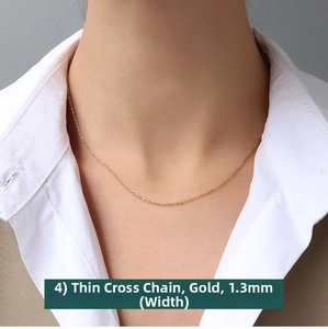 Detailed view of 1.3mm gold-plated cross chain necklace shown on a professional model