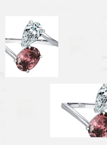 Macro detail of S925 sterling silver stamp and dual stones on a pear-shaped open ring