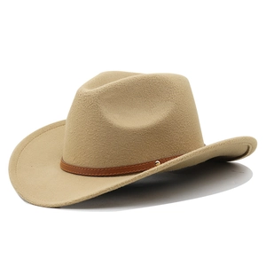 Detail of khaki felt cowboy hat with brown leather band and gold rivet accents