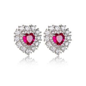 Detail shot of heart-shaped ruby earrings with micro-pave cubic zirconia on silver